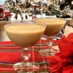 Two cups full of vegan egg nog on a table