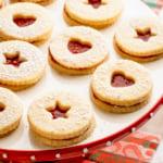 Linzer cookies on a cake pedestal